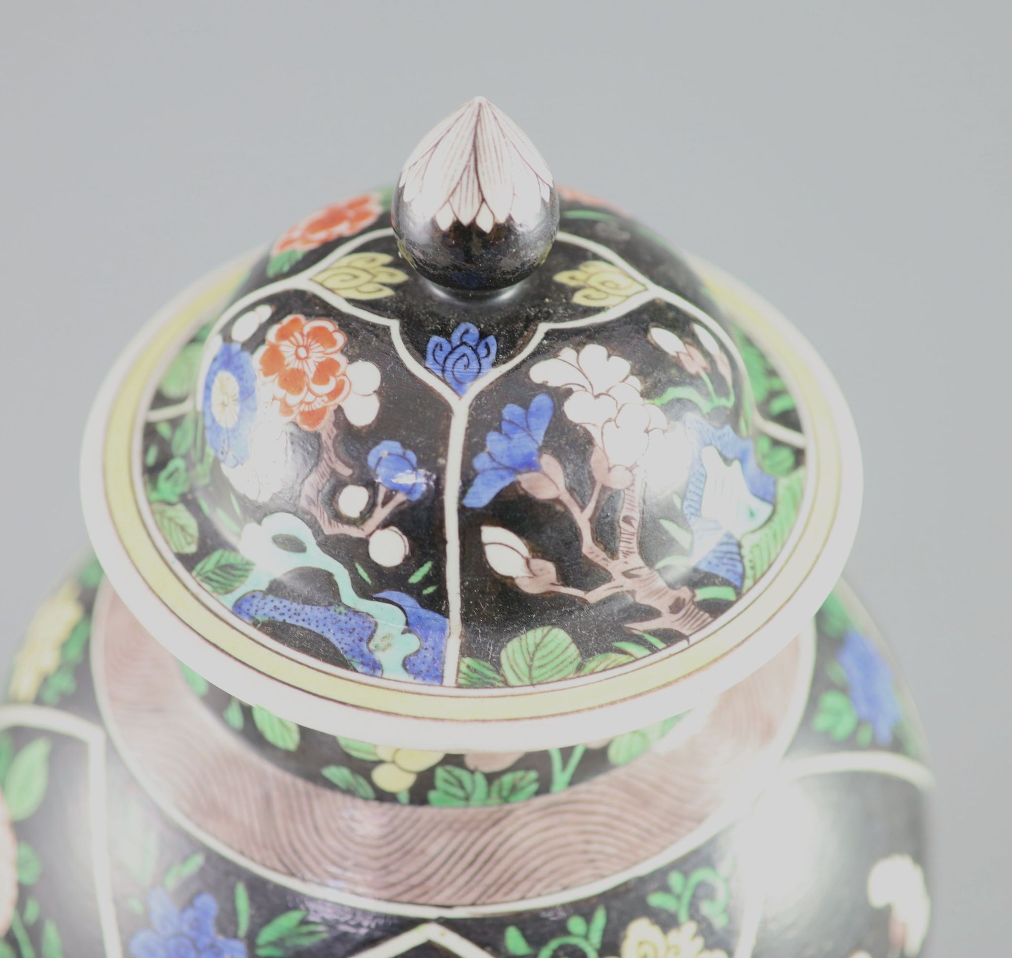 A Chinese famille noire enamelled biscuit baluster vase and cover, 19th century, 47cm high